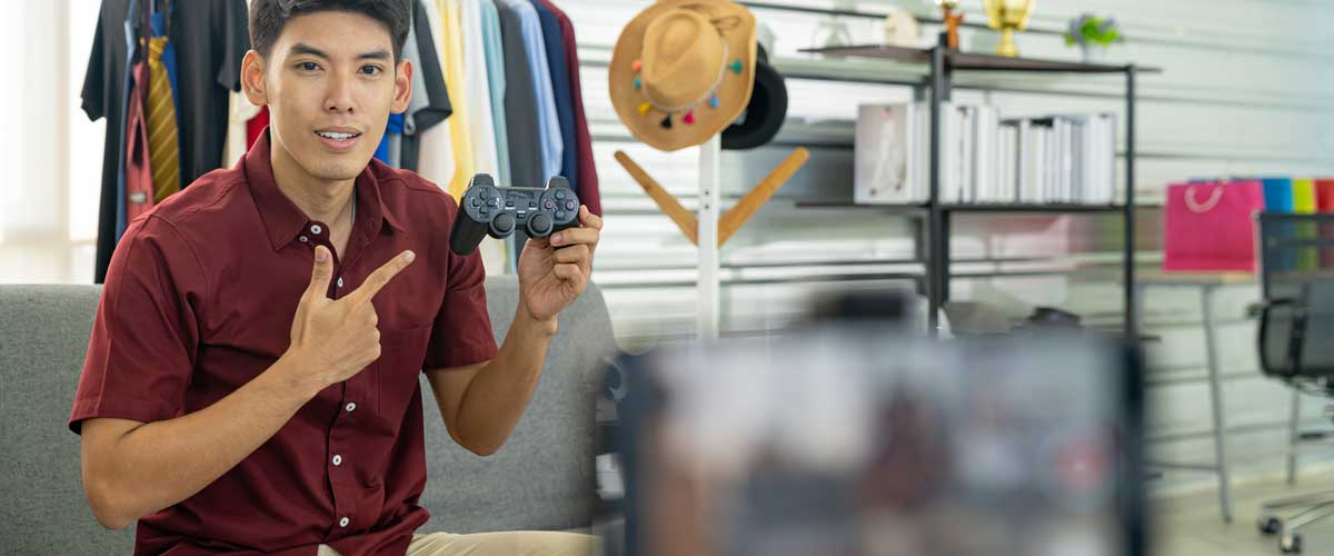 digital-marketing-trends-influencer Social media influencer reviewing joystick, camera in foreground